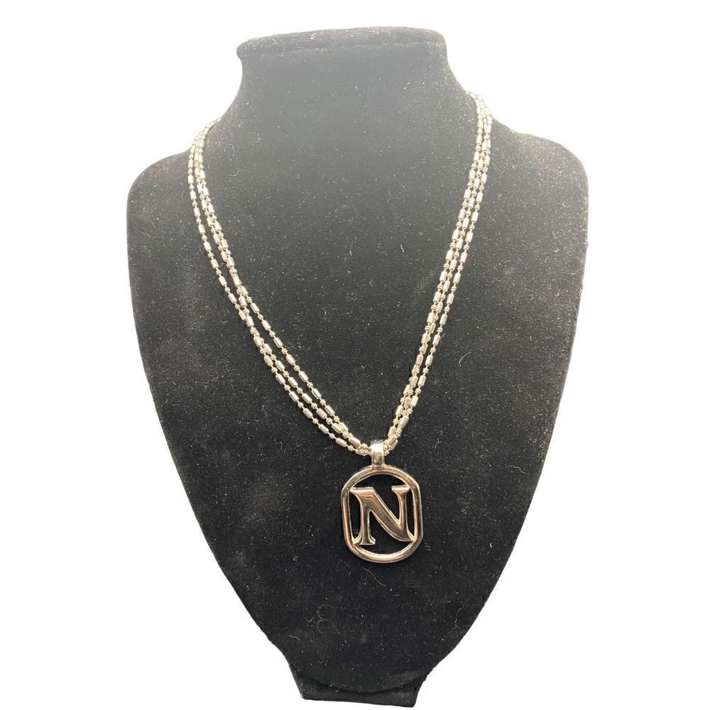 Three chain silver tone necklace with monogram “N” heart clasps